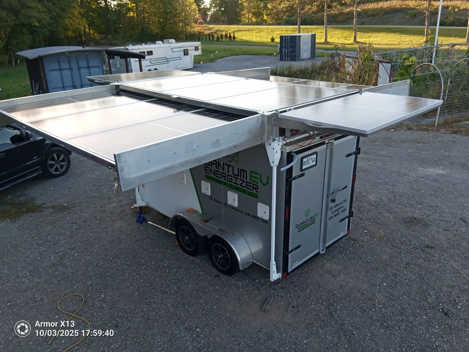 Insula expandable solar array trailer with panels folded for transport